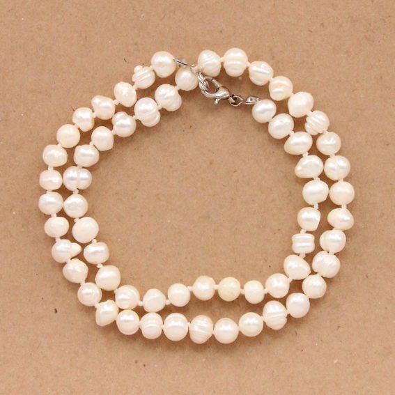 BUS020-6 Beads made of natural river pearls with a diameter of ~6-7mm